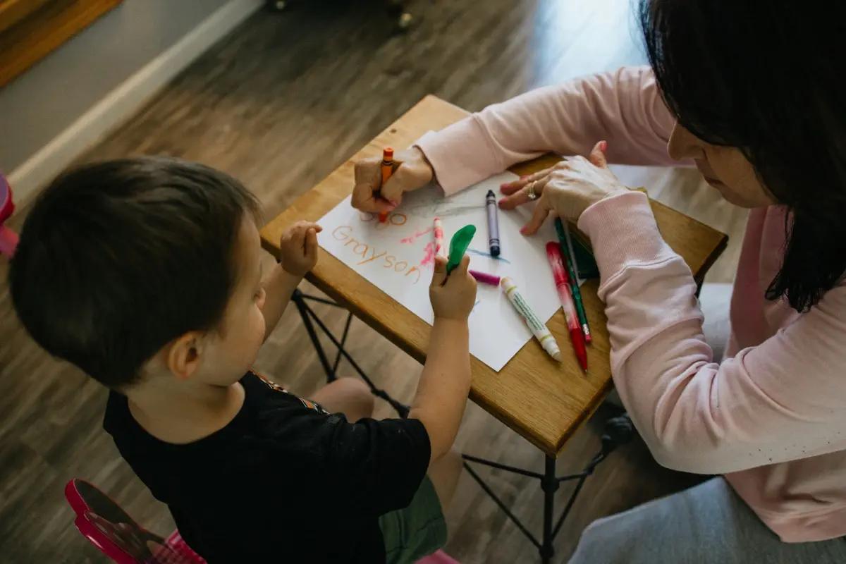 Two children working with calculators